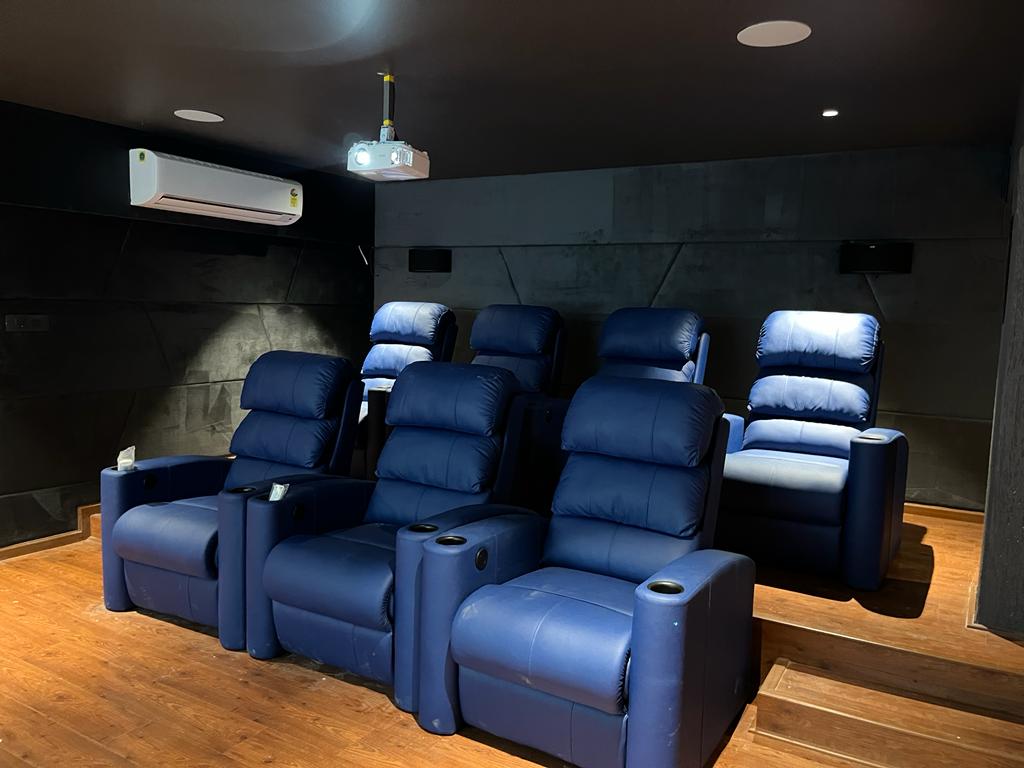 Home theatre with premium blue recliner seating