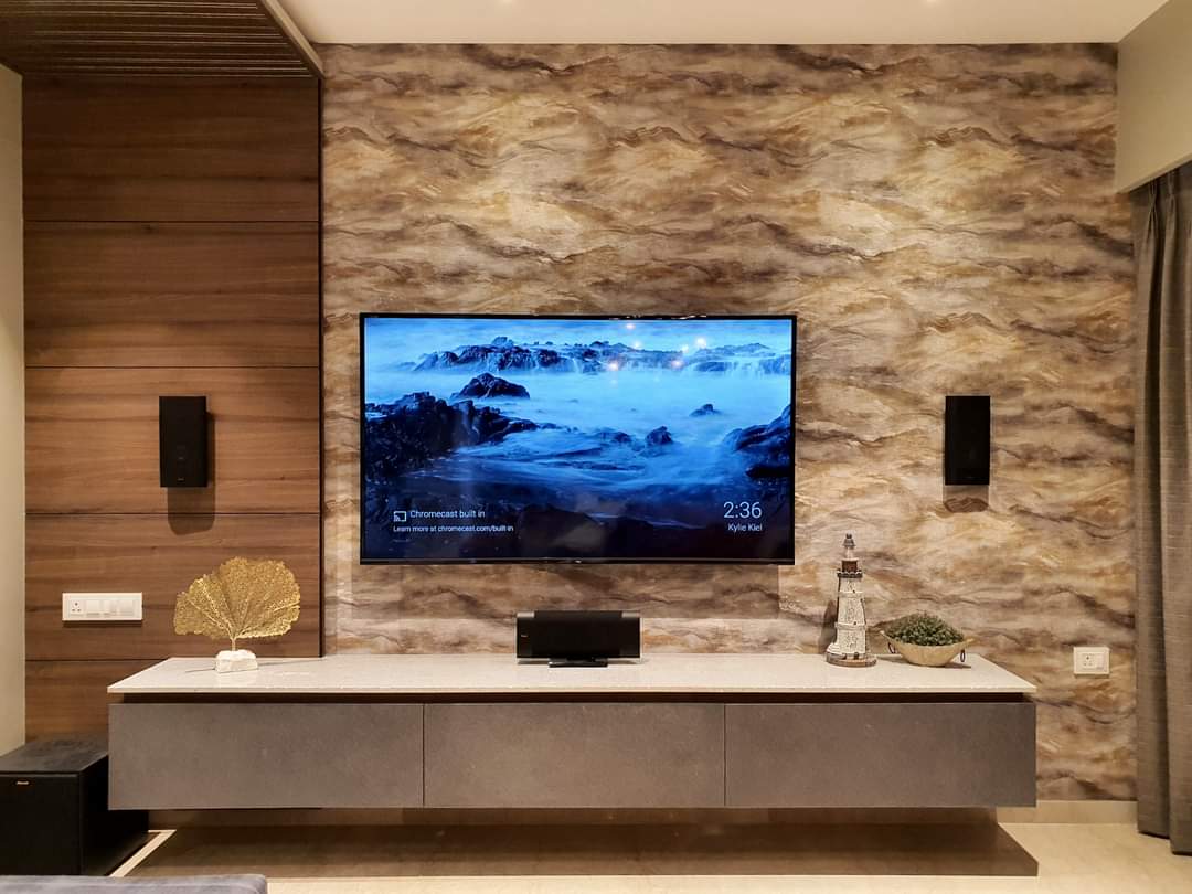 Wall-mounted TV with in-wall speaker installation