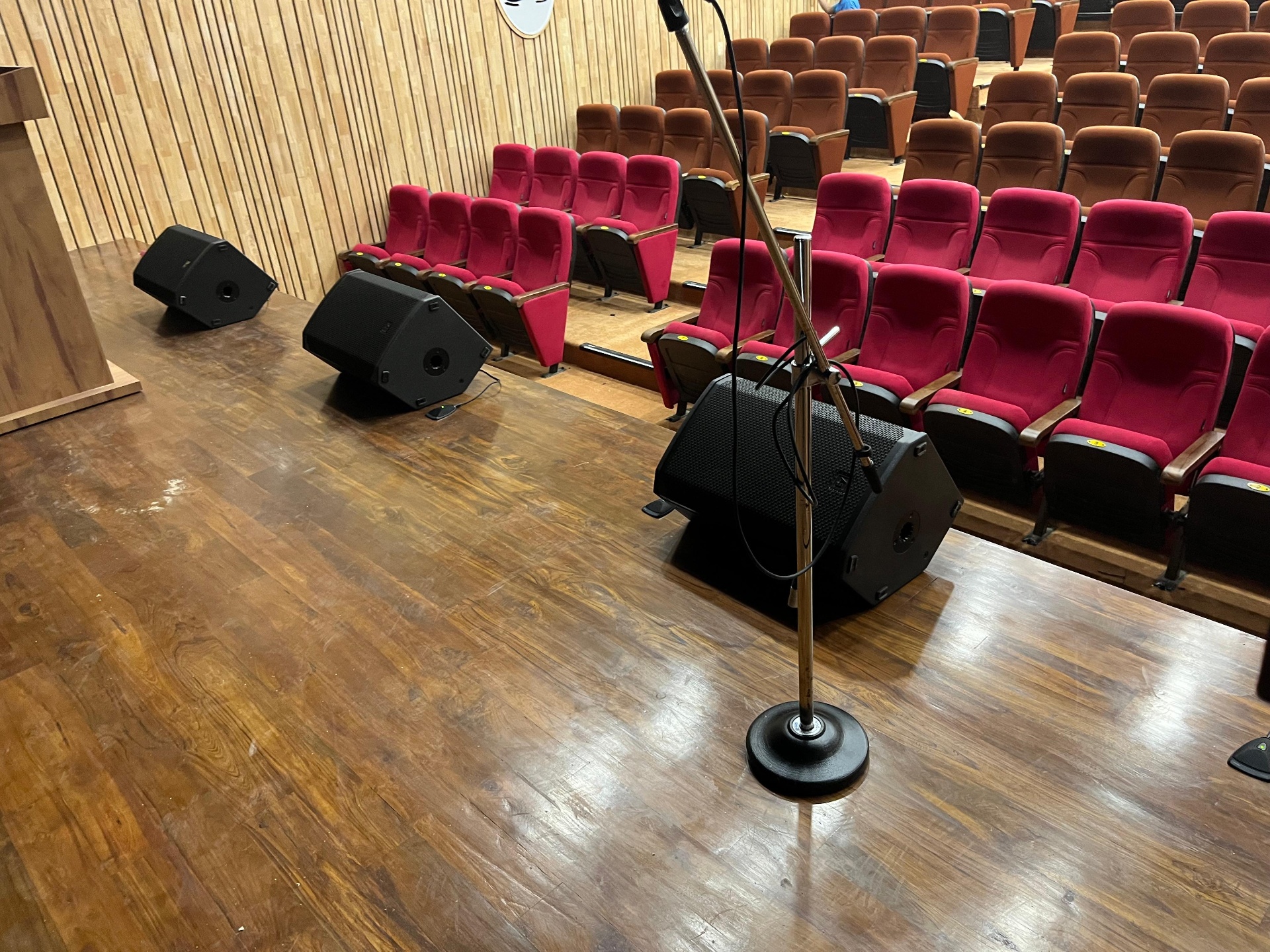 Auditorium stage monitors and microphone setup