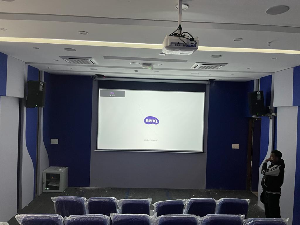 Auditorium with professional speakers, projection screen and BenQ projector